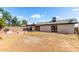 Expansive backyard with a brick patio, three fire pits, and a covered area offers ample space for outdoor enjoyment at 3008 W Michigan Ave, Phoenix, AZ 85053