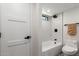 Updated bathroom featuring subway tile shower over tub with a modern white vanity at 3008 W Michigan Ave, Phoenix, AZ 85053