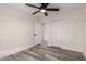 This light and bright bedroom features luxury vinyl plank flooring and a closet at 3008 W Michigan Ave, Phoenix, AZ 85053