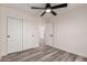 Bright bedroom features luxury vinyl plank flooring, sliding door closet and standard closet at 3008 W Michigan Ave, Phoenix, AZ 85053