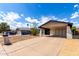 Single-story home with desert landscaping and a large covered carport at 3008 W Michigan Ave, Phoenix, AZ 85053