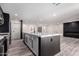 Open-concept kitchen with large waterfall island and seamless flow to dining and living spaces at 3008 W Michigan Ave, Phoenix, AZ 85053