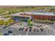 Beautiful aerial view of the community center, parking, and surrounding green spaces at 45144 W Desert Garden Rd, Maricopa, AZ 85139