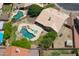 Beautiful aerial shot of home featuring a large pool, lush landscaping, and a peaceful backyard retreat at 870 N Criss St, Chandler, AZ 85226