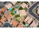 An aerial view displays the layout of a home with a fenced side yard within a residential neighborhood at 870 N Criss St, Chandler, AZ 85226