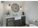 Elegant powder room features a stylish vanity with a vessel sink, modern fixtures, and decorative wall sconces at 10160 E Whispering Wind Dr, Scottsdale, AZ 85255