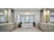 Luxurious bathroom with soaking tub, dual vanities, and elegant finishes at 10160 E Whispering Wind Dr, Scottsdale, AZ 85255