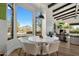 Charming breakfast nook with scenic views and access to the cozy living area at 10160 E Whispering Wind Dr, Scottsdale, AZ 85255