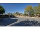 Paver driveway leads to a desert oasis with native landscaping and mountain views at 10160 E Whispering Wind Dr, Scottsdale, AZ 85255