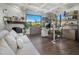 Bright home office boasts a cozy fireplace, large window with views, and built-in shelving for storage and decor at 10160 E Whispering Wind Dr, Scottsdale, AZ 85255