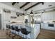 Gourmet kitchen with stainless steel appliances, a large marble island, and custom cabinetry at 10160 E Whispering Wind Dr, Scottsdale, AZ 85255
