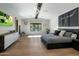 Spacious main bedroom featuring natural light, beamed ceilings, and backyard views at 10160 E Whispering Wind Dr, Scottsdale, AZ 85255
