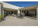Inviting outdoor patio complete with comfortable seating, dining area, and seamless indoor-outdoor flow for relaxing and entertaining at 10160 E Whispering Wind Dr, Scottsdale, AZ 85255