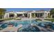 An inviting backyard oasis with a sparkling pool, spa, and meticulously landscaped patio for ultimate outdoor enjoyment at 10160 E Whispering Wind Dr, Scottsdale, AZ 85255