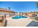 Backyard view featuring a swimming pool and lush landscaping at 10438 W Butler Dr, Peoria, AZ 85345