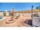 Backyard area with brick patio, firepit, seating area, and outdoor grill perfect for entertaining at 10438 W Butler Dr, Peoria, AZ 85345