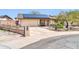 Beautiful single-story home featuring a two-car garage and lovely landscaping at 10438 W Butler Dr, Peoria, AZ 85345
