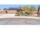 Charming single-story home featuring a two-car garage and solar panels on the roof at 10438 W Butler Dr, Peoria, AZ 85345