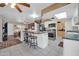 Bright kitchen features stainless steel appliances, a breakfast bar, and ample counter space at 10438 W Butler Dr, Peoria, AZ 85345