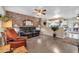 Warm and inviting living room featuring wood floors and an open concept design at 10438 W Butler Dr, Peoria, AZ 85345