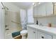 Well-lit bathroom featuring a shower-tub combination, white vanity, and neutral decor for a clean and fresh look at 111 S Greenfield Rd # 400, Mesa, AZ 85206