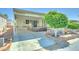 Spacious carport with additional outdoor seating and landscaped surroundings for a comfortable entrance at 111 S Greenfield Rd # 400, Mesa, AZ 85206