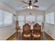 Cozy dining area with natural light, wood flooring, and an overhead fan with lighting at 111 S Greenfield Rd # 400, Mesa, AZ 85206