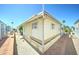 Exterior shot of a single-Gathering home with well-maintained surroundings and a paved walkway at 111 S Greenfield Rd # 400, Mesa, AZ 85206