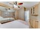 Bright main bedroom with closet, cabinets, and ceiling fan providing a serene and functional space for rest at 111 S Greenfield Rd # 400, Mesa, AZ 85206