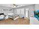 Well-lit secondary bedroom featuring carpet, and a window with plantation shutters at 11225 E Sylvan Ave, Mesa, AZ 85212