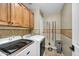 Well-equipped laundry room with ample storage space and modern appliances at 11225 E Sylvan Ave, Mesa, AZ 85212