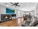 Living room with a fireplace and view to the kitchen at 11225 E Sylvan Ave, Mesa, AZ 85212