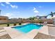Inviting backyard pool with beautiful desert landscaping, lounge chairs, and a serene atmosphere at 11225 E Sylvan Ave, Mesa, AZ 85212