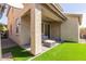 Covered back patio with comfortable seating and a great view of the backyard at 11979 W Pierce St, Avondale, AZ 85323