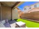 Relaxing covered back patio with comfortable seating and a great view of the backyard at 11979 W Pierce St, Avondale, AZ 85323