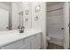 Well lit bathroom with modern fixtures, cabinets, and shower/tub combo at 11979 W Pierce St, Avondale, AZ 85323