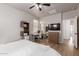 This bright bedroom features a ceiling fan, natural light, desk and mirrored closet doors at 11979 W Pierce St, Avondale, AZ 85323