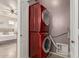 Modern laundry room features stackable machines at 11979 W Pierce St, Avondale, AZ 85323