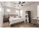 This main bedroom features a ceiling fan, natural light and neutral tones at 11979 W Pierce St, Avondale, AZ 85323