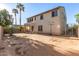 View of the backyard, showcasing a covered patio, basketball hoop, and ample space for activities at 12911 W Campbell Ave, Litchfield Park, AZ 85340