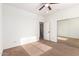 The bedroom is spacious and bright, with a ceiling fan and a large closet at 12911 W Campbell Ave, Litchfield Park, AZ 85340