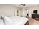 Bedroom with hardwood flooring, ceiling fan and a three-window view at 12911 W Campbell Ave, Litchfield Park, AZ 85340
