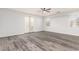 Large bedroom with ceiling fan, french doors, and bright natural light at 12911 W Campbell Ave, Litchfield Park, AZ 85340