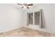 Bright bedroom with ceiling fan and neutral finishes at 12911 W Campbell Ave, Litchfield Park, AZ 85340