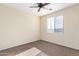 Neutral bedroom featuring a ceiling fan and a window at 12911 W Campbell Ave, Litchfield Park, AZ 85340