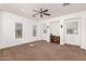 Large bonus room features carpeted floors, recessed lighting, and multiple windows at 12911 W Campbell Ave, Litchfield Park, AZ 85340