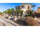 Desert home with lush landscaping, a gated drive and beautiful front entry at 12911 W Campbell Ave, Litchfield Park, AZ 85340