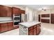 Kitchen with island, stainless steel appliances, and double oven at 12911 W Campbell Ave, Litchfield Park, AZ 85340