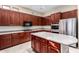 Gourmet kitchen features stainless appliances, ample storage, and large island at 12911 W Campbell Ave, Litchfield Park, AZ 85340