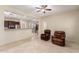 Open-concept living room with tile floors and cozy seating at 12911 W Campbell Ave, Litchfield Park, AZ 85340